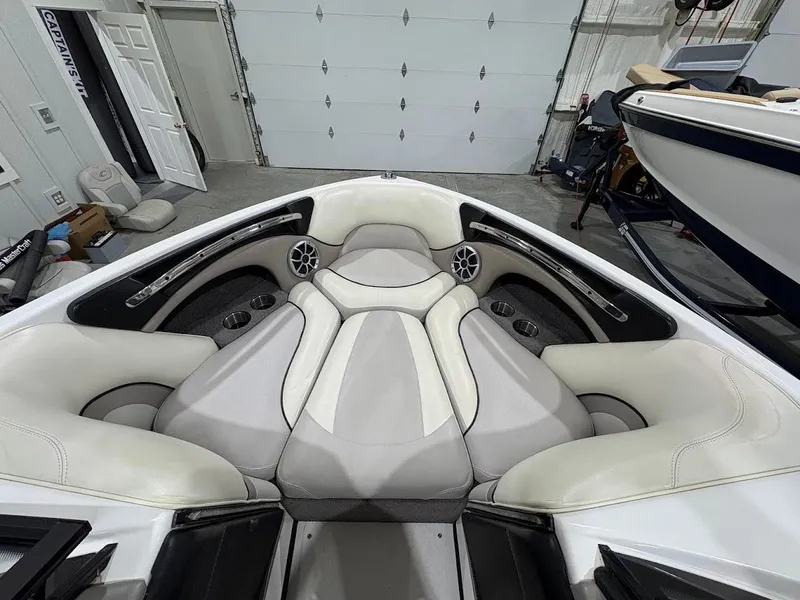 Slide: The Image of 2011 Malibu Wakesetter 21 VLX boat interior with white and gray seating. - 7