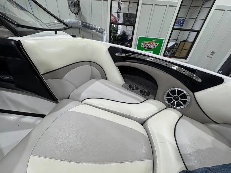 Slide: The Image of Interior of a 2011 Malibu Wakesetter 21 VLX boat with white and gray seating. - 9