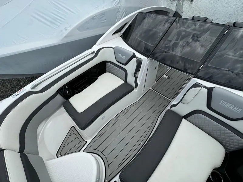 Slide: The Image of 2021 Yamaha Boats 275SE interior with sleek seating and modern design. - 13