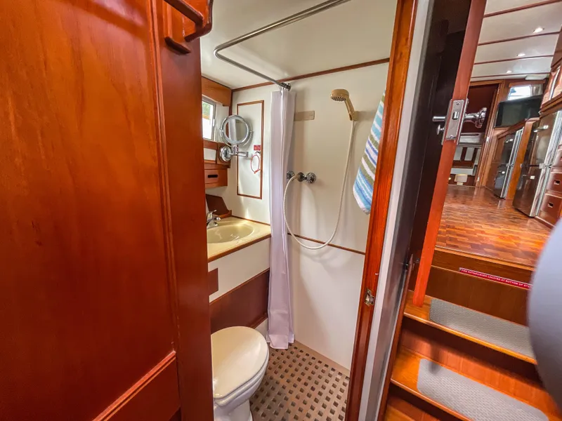 Slide: The Image of 1989 Grand Banks 42 Classic yacht bathroom with wooden interior and shower area. - 17