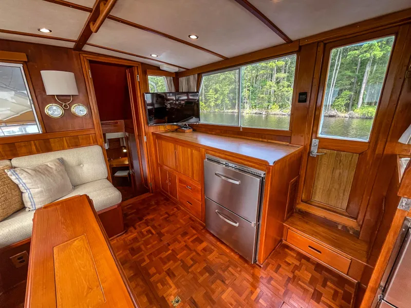 Slide: The Image of Interior of 1989 Grand Banks 42 Classic yacht with wood paneling and modern amenities. - 23