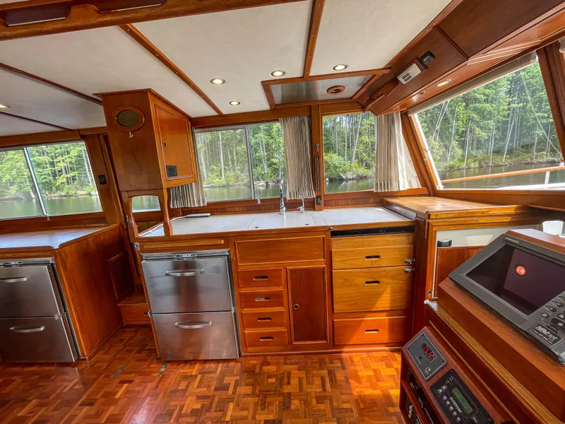 Slide: The Image of Interior of 1989 Grand Banks 42 Classic yacht with wood cabinetry and modern appliances. - 30
