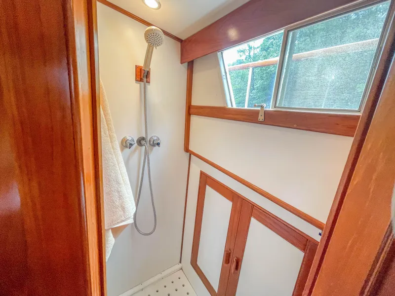 Slide: The Image of Shower area in 1989 Grand Banks 42 Classic yacht with wooden accents. - 38