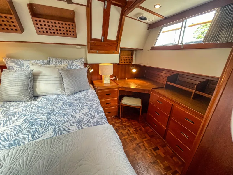Slide: The Image of Cozy bedroom in 1989 Grand Banks 42 Classic yacht with wooden furnishings and natural light. - 41
