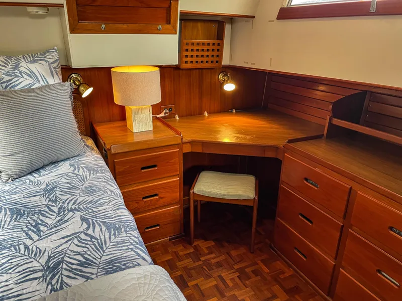 Slide: The Image of Cozy cabin interior of 1989 Grand Banks 42 Classic with wooden desk and bed. - 42