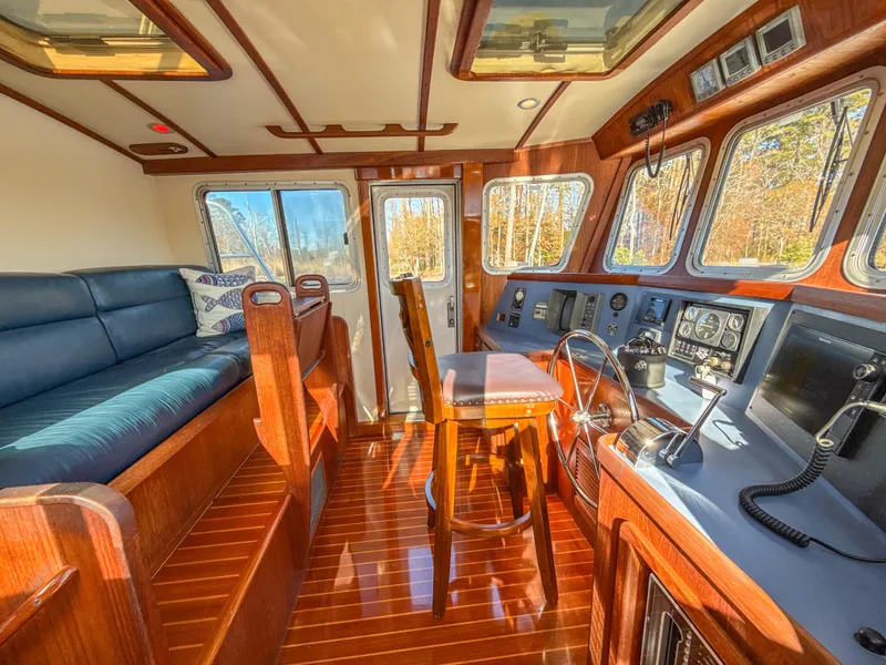 Slide: The Image of Luxurious 2000 Cherubini Independence yacht interior with wooden finishes and navigation controls. - 12