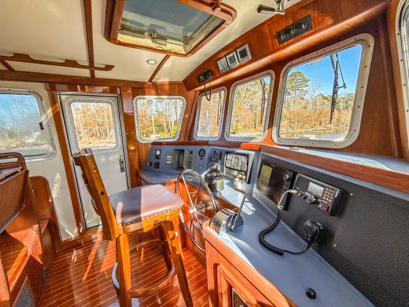 Slide: The Image of Pilothouse interior of 2000 Cherubini Independence boat with wooden accents and navigation equipment. - 13