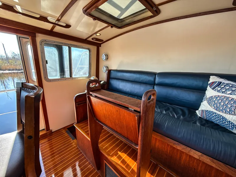 Slide: The Image of Luxurious interior of 2000 Cherubini Independence boat with leather seating and wooden accents. - 16