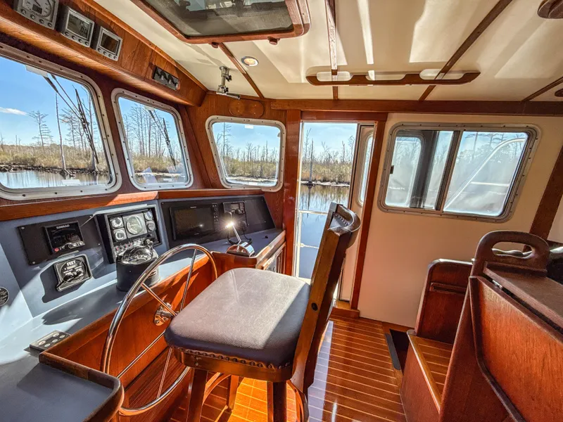 Slide: The Image of Interior of 2000 Cherubini Independence boat with wooden helm and panoramic windows. - 17