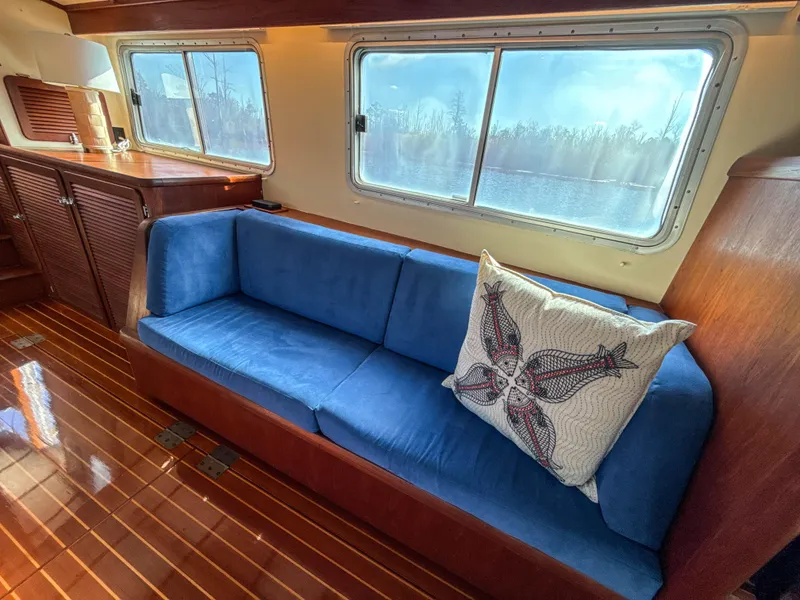Slide: The Image of Luxurious Cherubini Independence 2000 yacht interior with blue sofa and decorative pillow. - 19