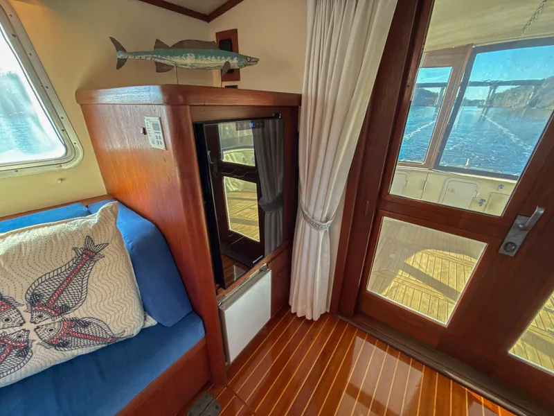Slide: The Image of Cozy interior of 2000 Cherubini Independence yacht with wooden accents and scenic water view. - 20