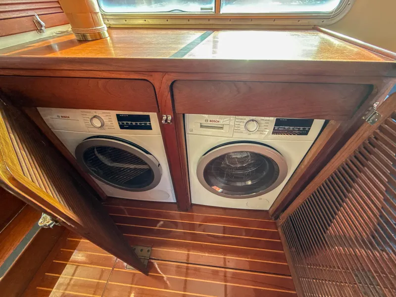 Slide: The Image of Built-in Bosch washer and dryer in a 2000 Cherubini Independence yacht. - 27