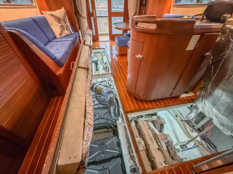 Slide: The Image of Interior of 2000 Cherubini Independence yacht with open engine compartment and wooden furnishings. - 28