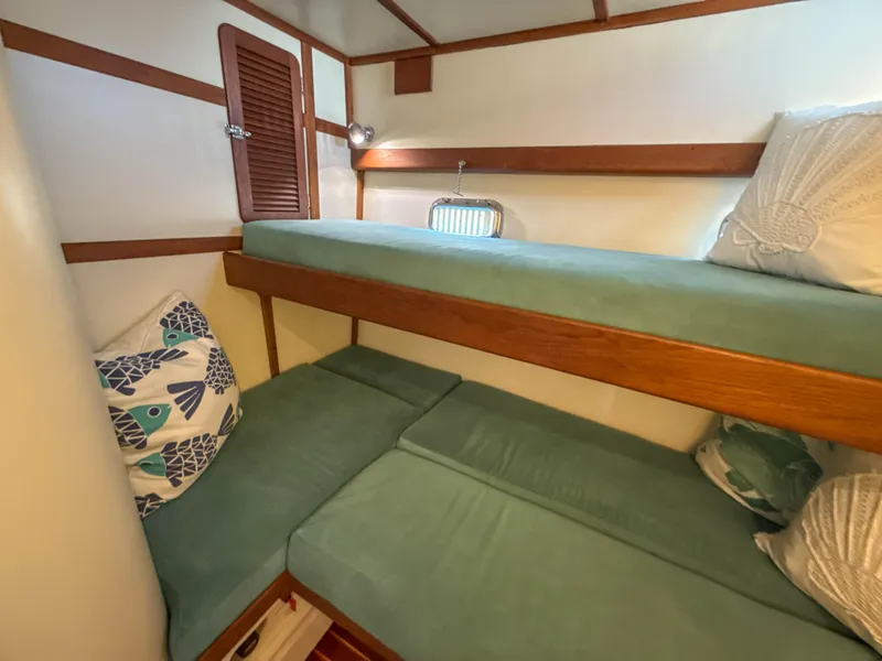 Slide: The Image of Cozy cabin with bunk beds in 2000 Cherubini Independence yacht. - 35
