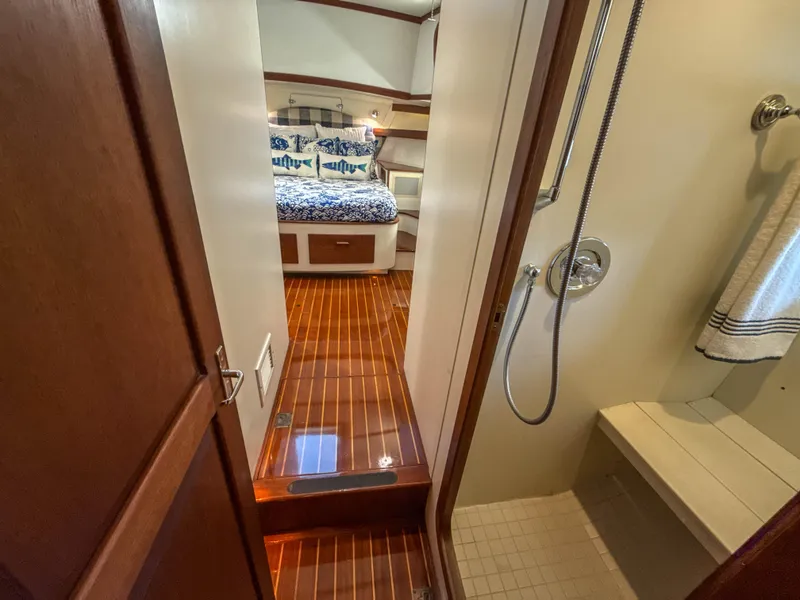 Slide: The Image of Luxurious 2000 Cherubini Independence yacht interior with wooden flooring and cozy bedroom. - 39