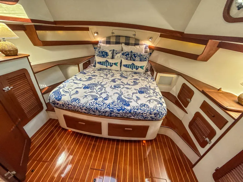 Slide: The Image of Luxurious cabin interior of 2000 Cherubini Independence yacht with nautical-themed bedding. - 44