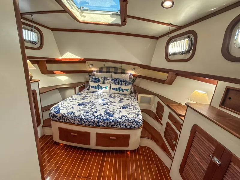 Slide: The Image of Luxurious 2000 Cherubini Independence yacht cabin with elegant wood finish and cozy bedding. - 46