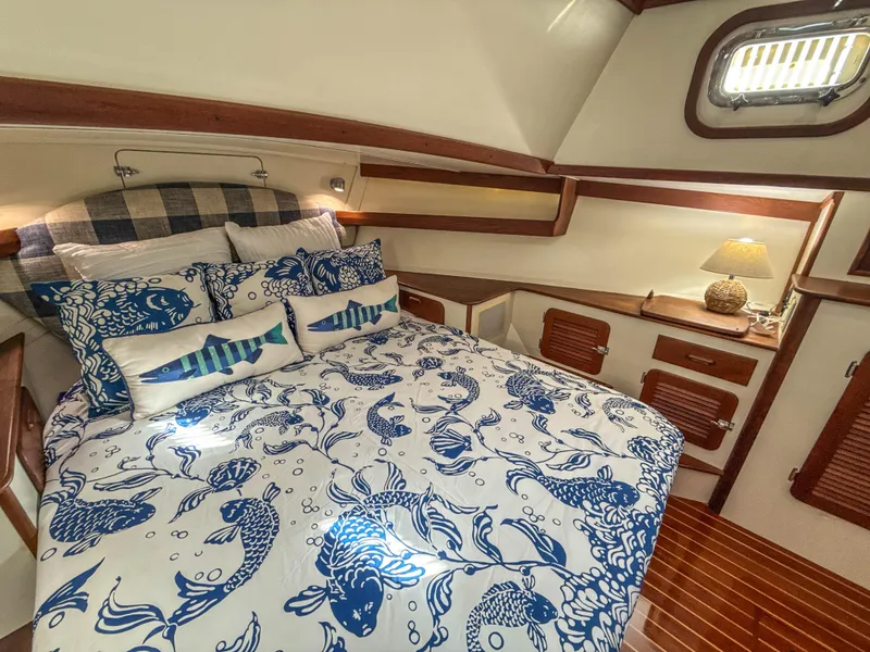 Slide: The Image of Luxurious cabin interior of 2000 Cherubini Independence yacht with nautical-themed bedding. - 48