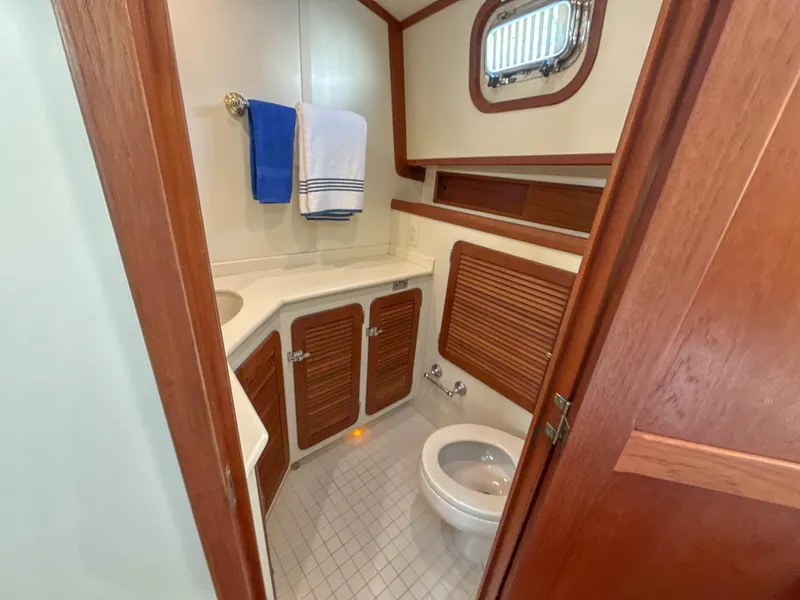 Slide: The Image of Bathroom interior of 2000 Cherubini Independence yacht with wood accents and compact design. - 50