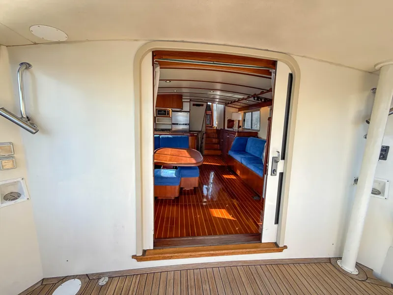 Slide: The Image of Interior view of 2000 Cherubini Independence yacht with wooden flooring and blue seating. - 51