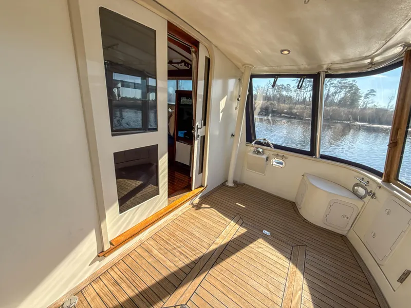 Slide: The Image of Spacious interior of 2000 Cherubini Independence boat with wooden flooring and large windows. - 53