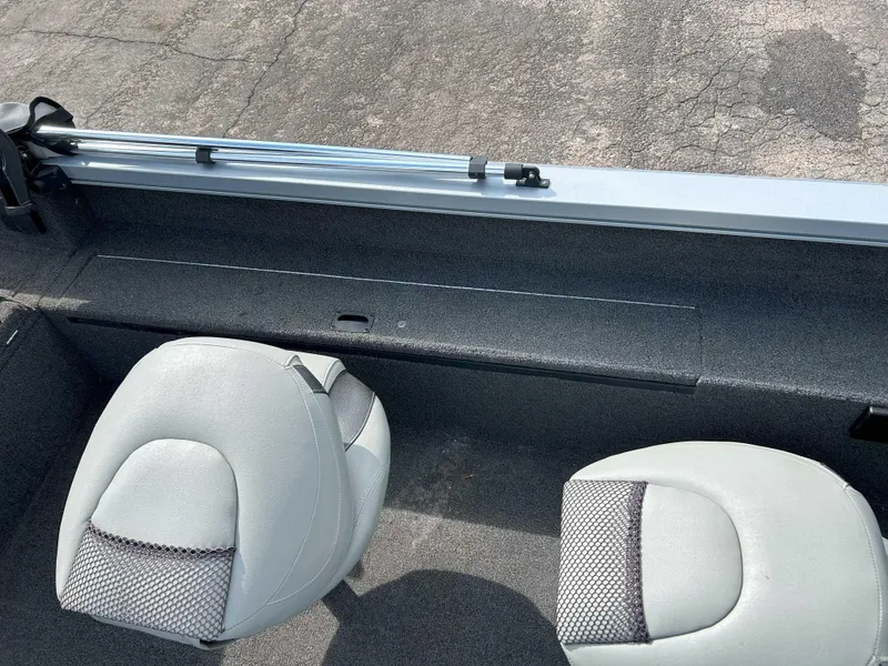 Slide: The Image of Interior of a 2013 Lowe 185 Pro Series boat with two gray seats. - 10