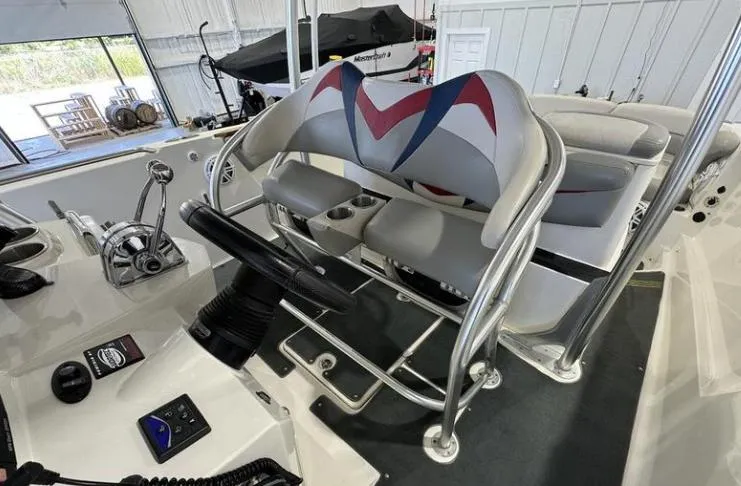 Slide: The Image of 2009 MasterCraft CSX 265 SS boat interior with steering wheel and seating. - 11