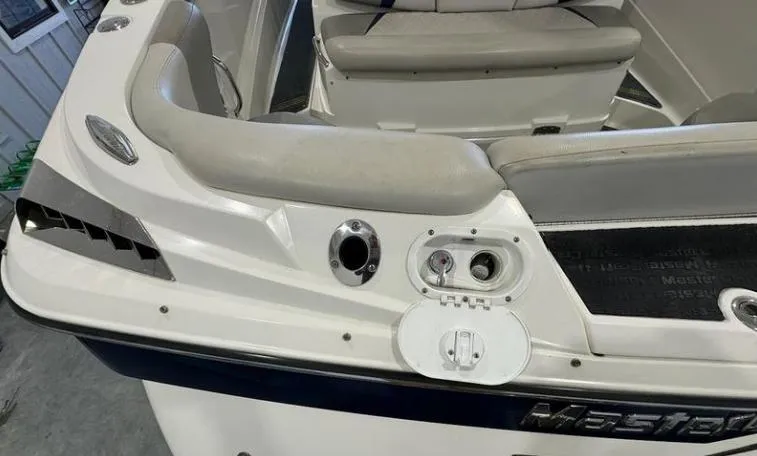 Slide: The Image of 2009 MasterCraft CSX 265 SS boat interior with seating and control panel. - 21