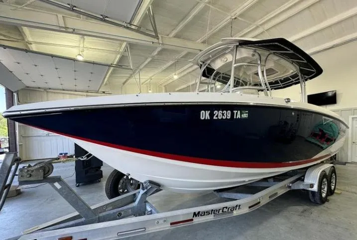 Slide: The Image of 2009 MasterCraft CSX 265 SS boat on trailer in a garage setting. - 7