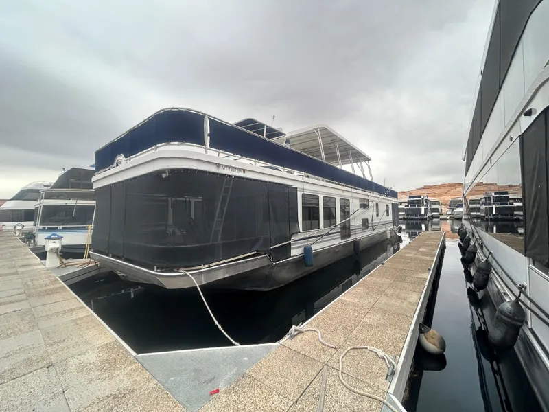 Slide: The Image of Houseboat docked at marina, American Waterways Sweet Escape 4 shares, 2006 model. - 1