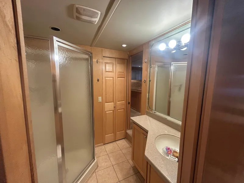 Slide: The Image of Bathroom interior of 2006 American Waterways Sweet Escape, featuring shower and vanity. - 11