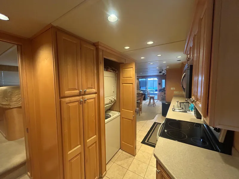 Slide: The Image of Interior of 2006 American Waterways Sweet Escape houseboat with kitchen and laundry area. - 12