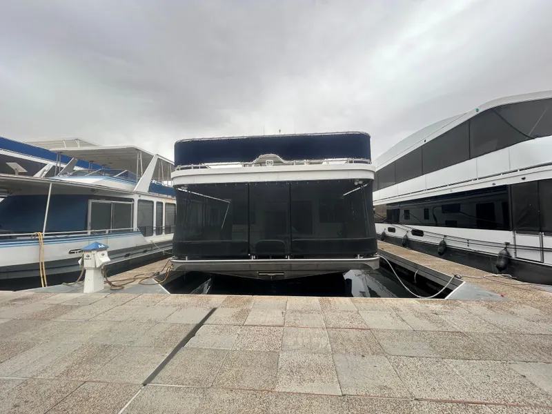 Slide: The Image of Houseboat docked at marina, American Waterways Sweet Escape 4 shares, 2006 model. - 2