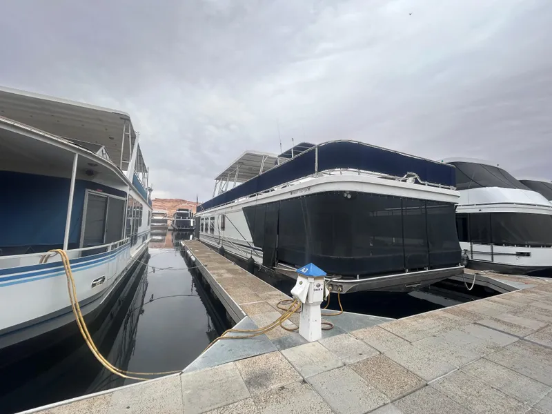 Slide: The Image of Houseboats docked at marina, featuring 2006 American Waterways Sweet Escape model. - 3