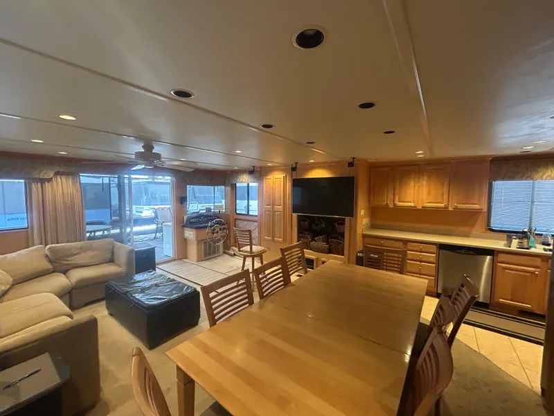 Slide: The Image of Luxurious 2006 American Waterways houseboat interior with spacious living area and modern kitchen. - 6