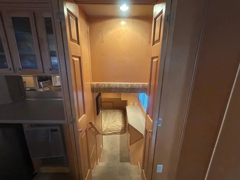 Slide: The Image of Interior of 2006 American Waterways Sweet Escape, featuring cozy cabin with wood finish and ambient lighting. - 7