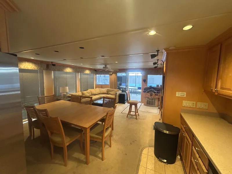 Slide: The Image of Spacious interior of 2006 American Waterways Sweet Escape houseboat with dining area and lounge. - 8