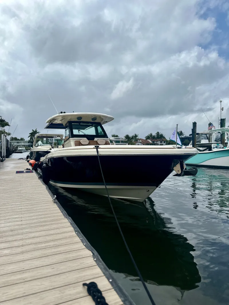Slide: The Image of 2025 Chris-Craft Catalina boat docked at marina under cloudy sky. - 5