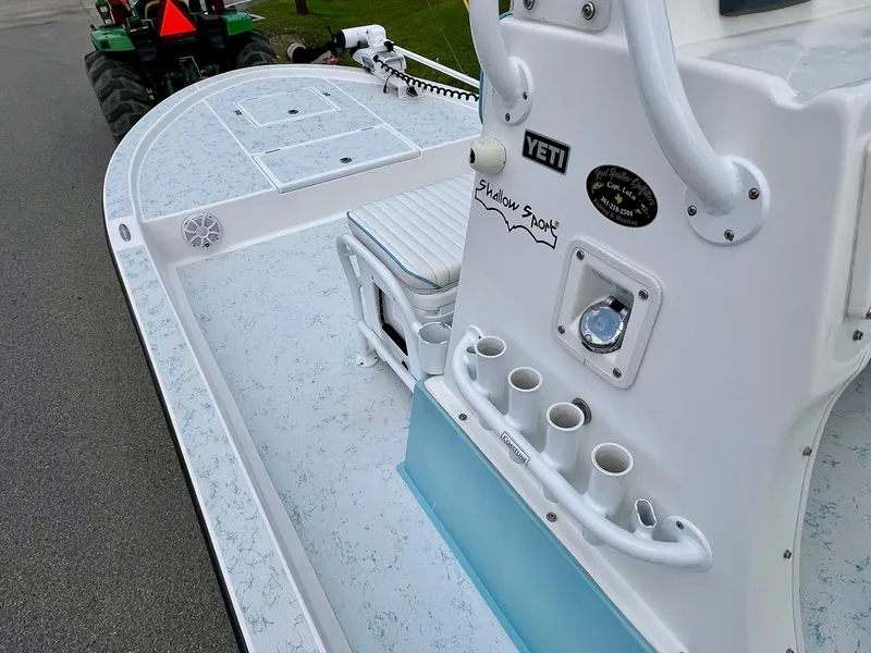 Slide: The Image of 2017 Shallow Sport 24 Sport boat deck with rod holders and seating. - 12