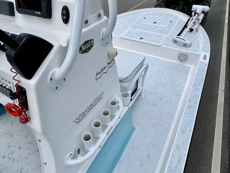 Slide: The Image of 2017 Shallow Sport 24 Sport boat interior with console and rod holders. - 14