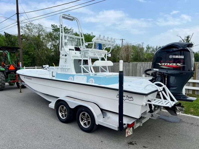 Slide: The Image of 2017 Shallow Sport 24 Sport boat on trailer with Yamaha outboard motor. - 2