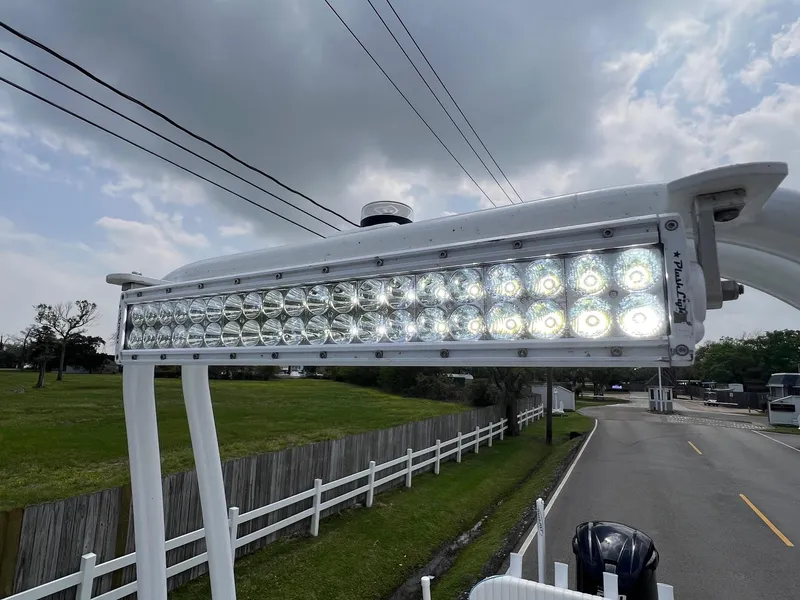 Slide: The Image of LED light bar on 2017 Shallow Sport 24 Sport boat, overcast sky background. - 20