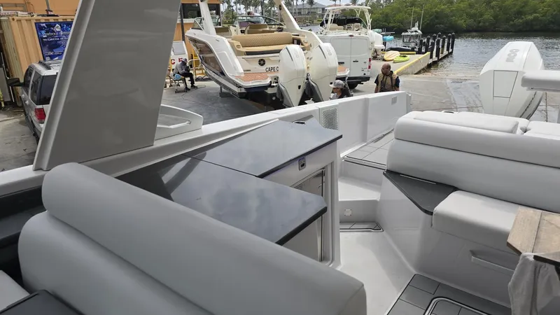 Slide: The Image of Aviara AV32 OB 2020 luxury boat interior with seating and dock view. - 10