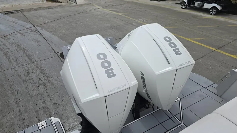 Slide: The Image of Twin Mercury 300 outboard engines on a 2020 Aviara AV32 OB boat. - 12