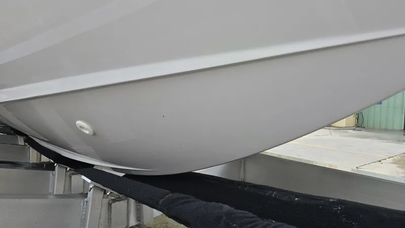 Slide: The Image of Close-up of 2020 Aviara AV32 OB boat hull on a trailer. - 13
