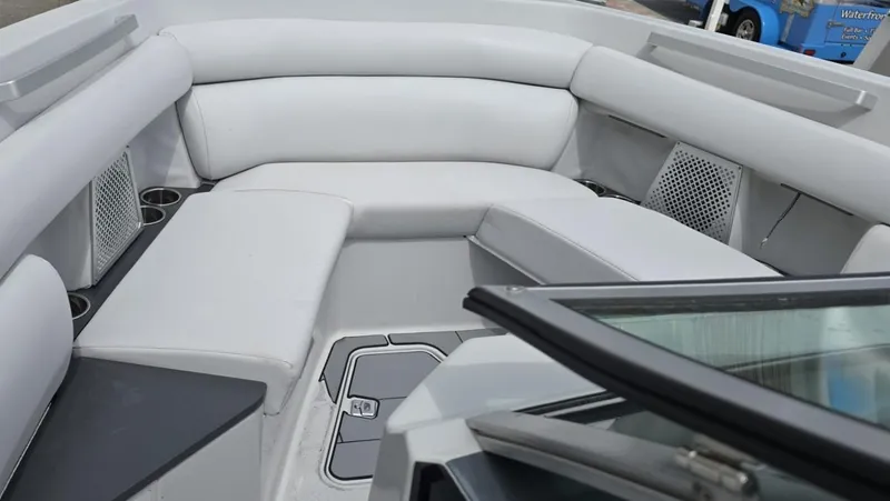 Slide: The Image of Luxurious seating area on a 2020 Aviara AV32 OB boat, featuring sleek white upholstery. - 6