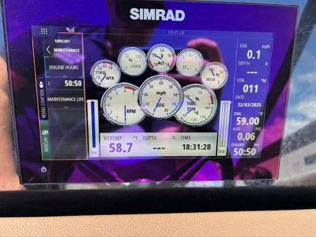 Slide: The Image of Simrad display showing engine metrics for 2018 Sea Ray SPX 210 boat. - 13