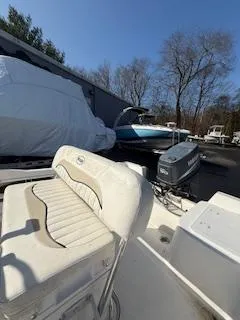 Slide: The Image of 2009 Key West 1720 Center Console boat with seating, parked outdoors. - 4