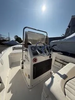 Slide: The Image of 2009 Key West 1720 Center Console boat interior with steering wheel and controls. - 5