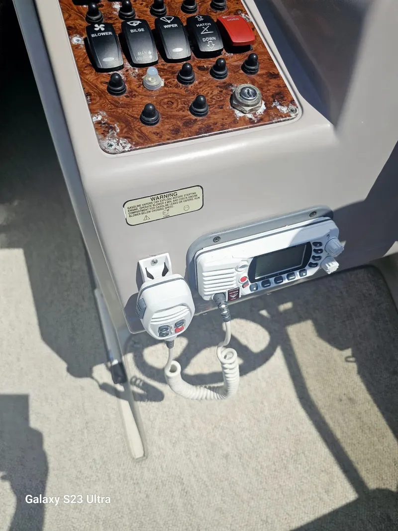 Slide: The Image of Control panel of a 2000 Regal 2800 LSR boat with radio and switches. - 12